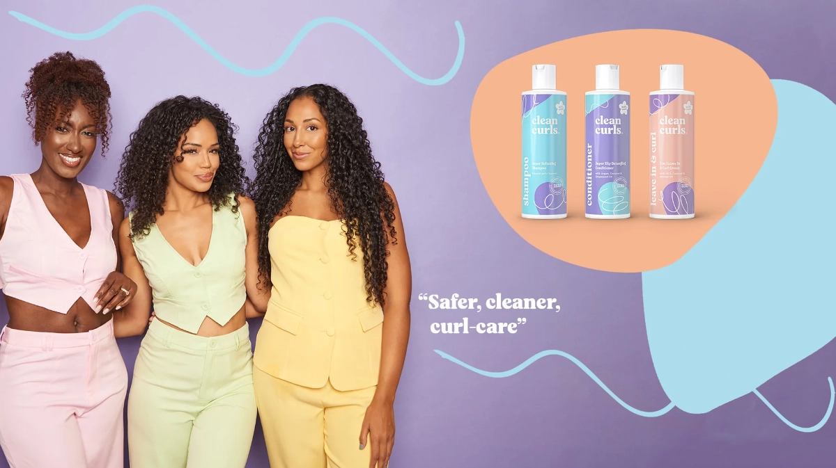 Three women with natural curly hair standing next to product line graphics featuring Asikue font in use