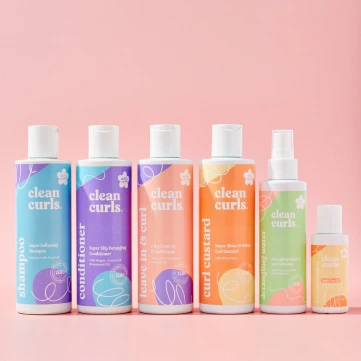 A complete lineup of six hair and skin care bottles in pastel colors featuring Asikue font in use