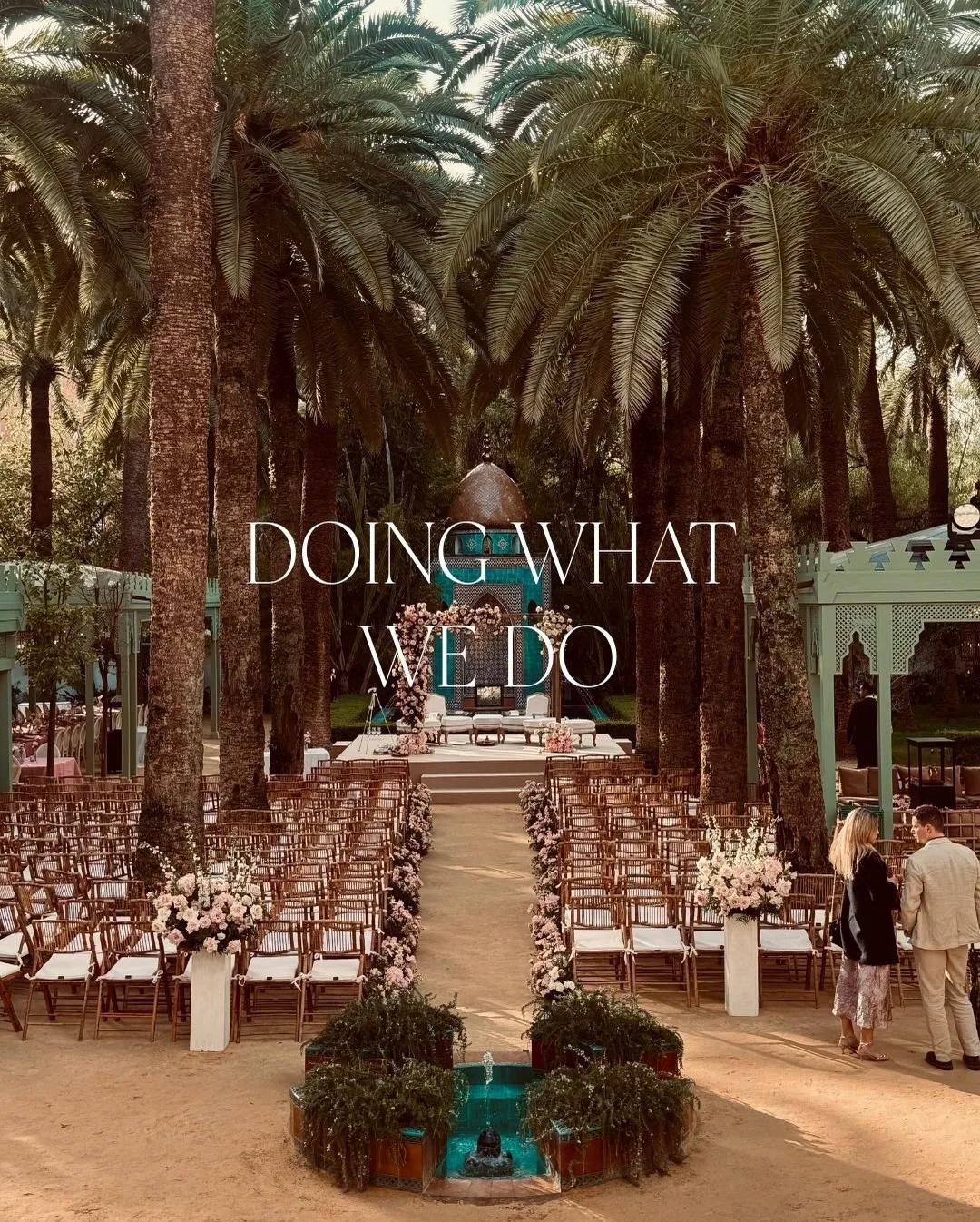 Elegant outdoor wedding ceremony setup among palm trees with a premium typographic heading featuring San De More font in use